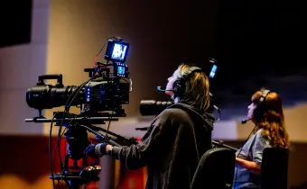 Event management team handling production and technical setup for a business event