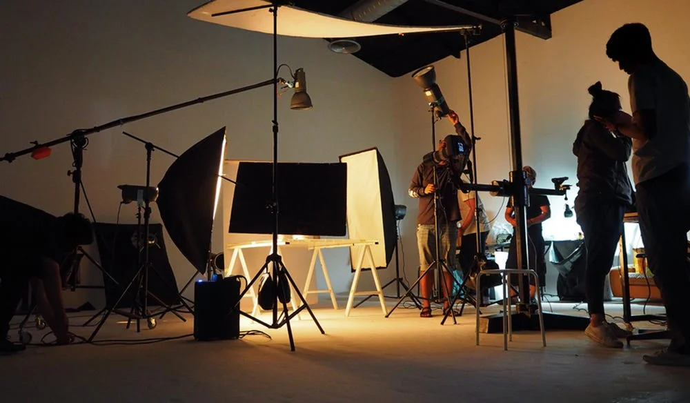 Audio-visual production team filming a professional video project